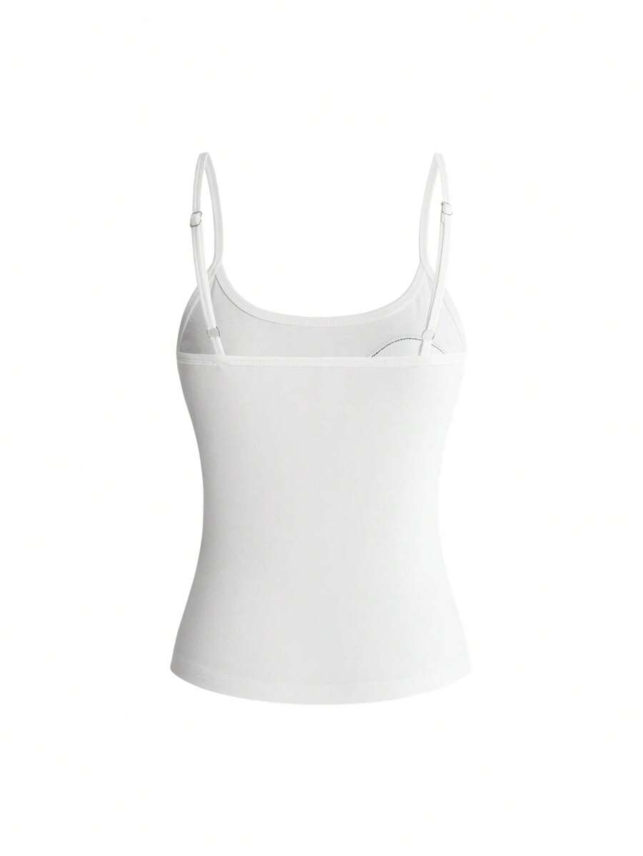 Women's white graphic tank top featuring a cartoon 3D applique patch with a slim fit sleeveless cut.
