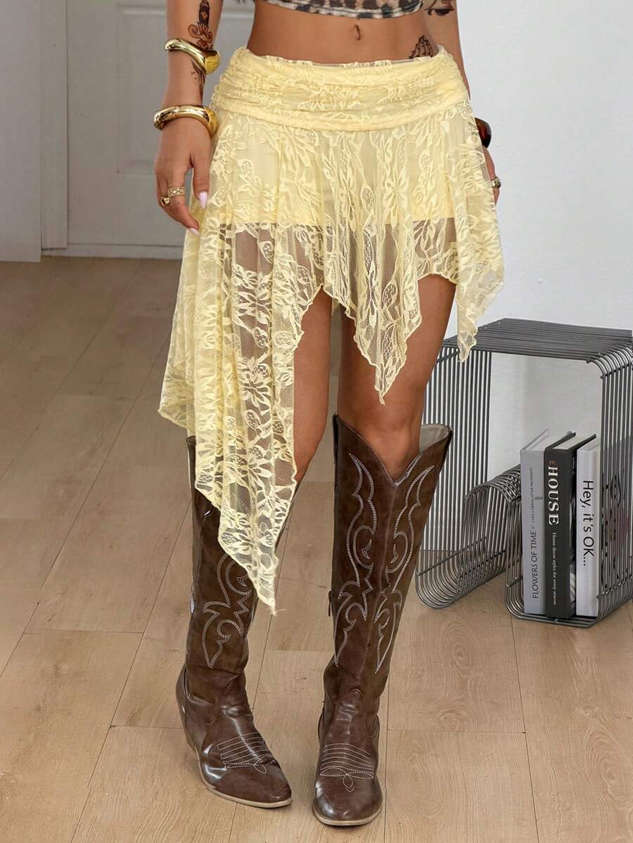 Women's asymmetrical ruffle skort with low waist, hollow out details, and lined body in knitted stretch fabric for beach and summer wear.