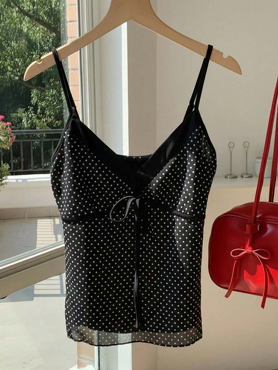 Black and white polka dot tie strap camisole top for women with thin spaghetti straps and slim fit.