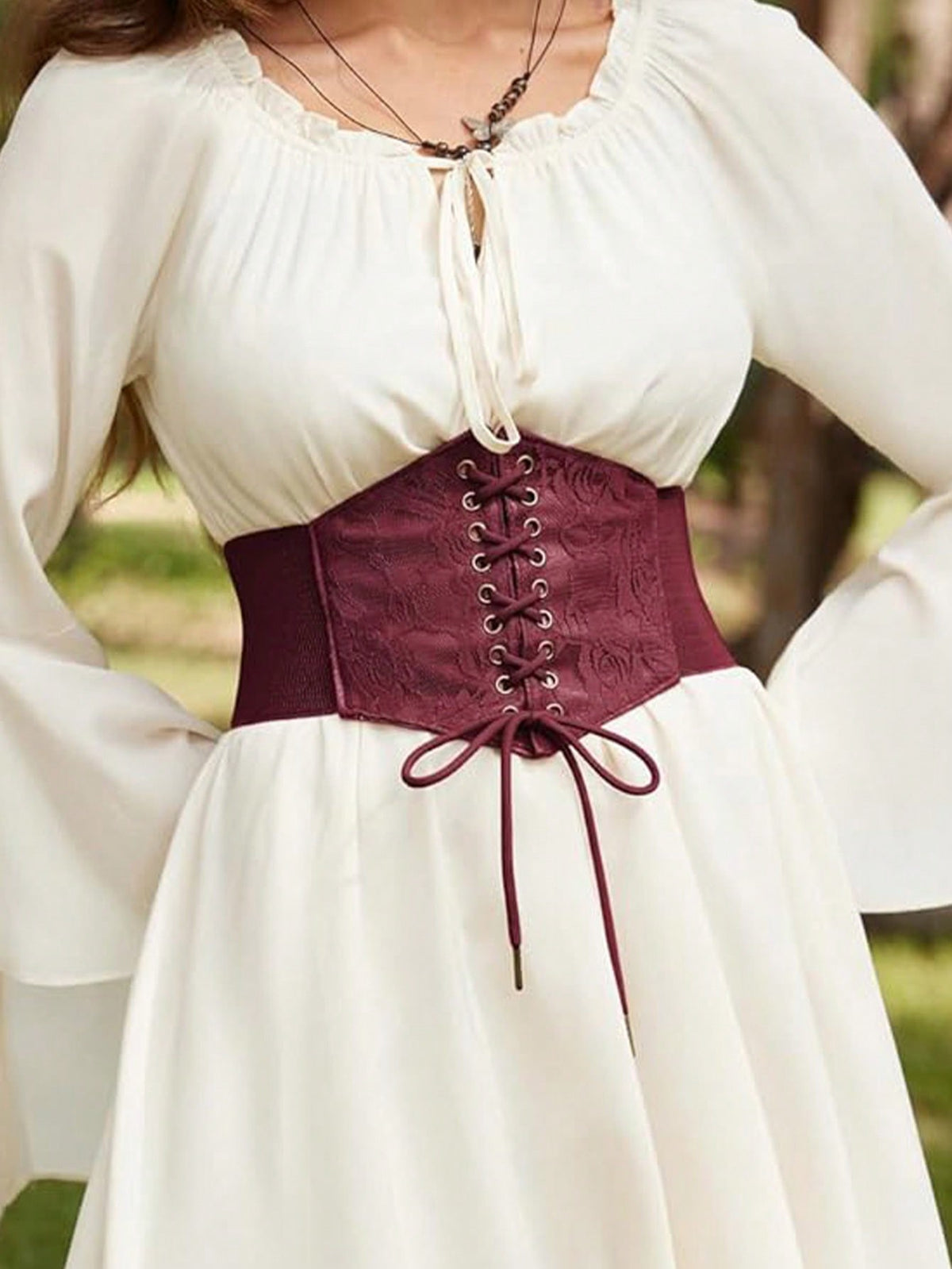 Black lace-up waist cincher with grommet eyelets, baroque pattern, medium stretch, and wide belt design for women.