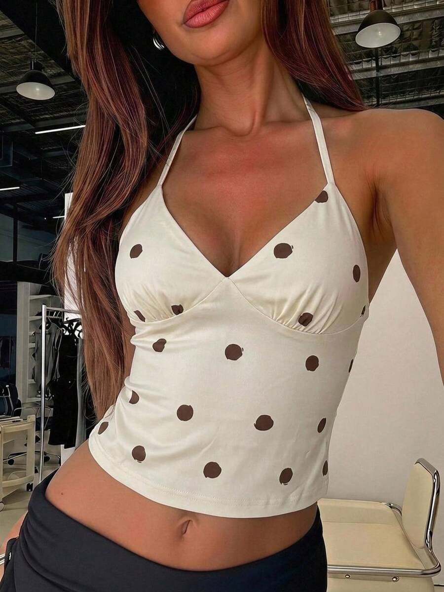 Women's black faux leather backless cami top with spaghetti straps and lace-up shirred sides.