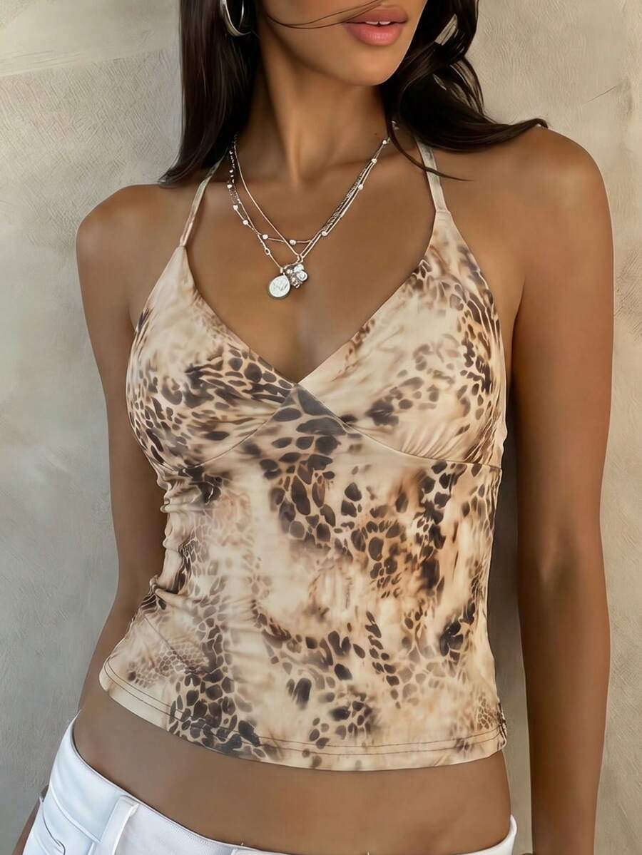 Women's black faux leather backless cami top with spaghetti straps and lace-up shirred sides.