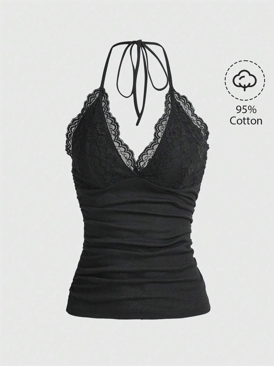 A women's black backless halter top featuring contrast lace trim, ruched front detail, and slim fit soft knitted fabric.