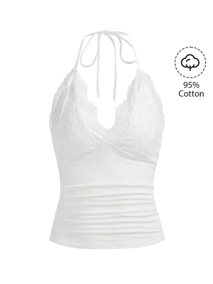 A women's black backless halter top featuring contrast lace trim, ruched front detail, and slim fit soft knitted fabric.
