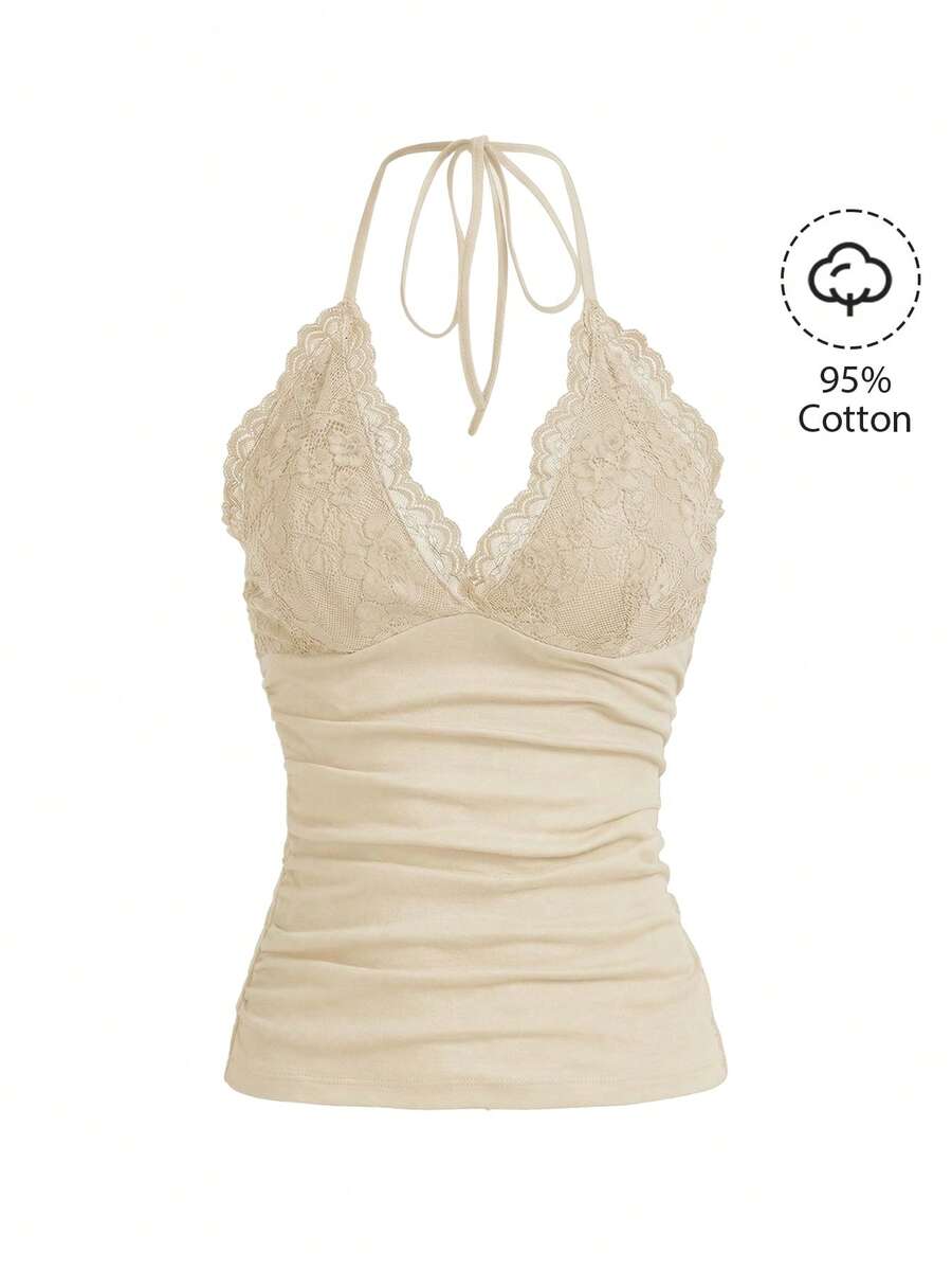 A women's black backless halter top featuring contrast lace trim, ruched front detail, and slim fit soft knitted fabric.
