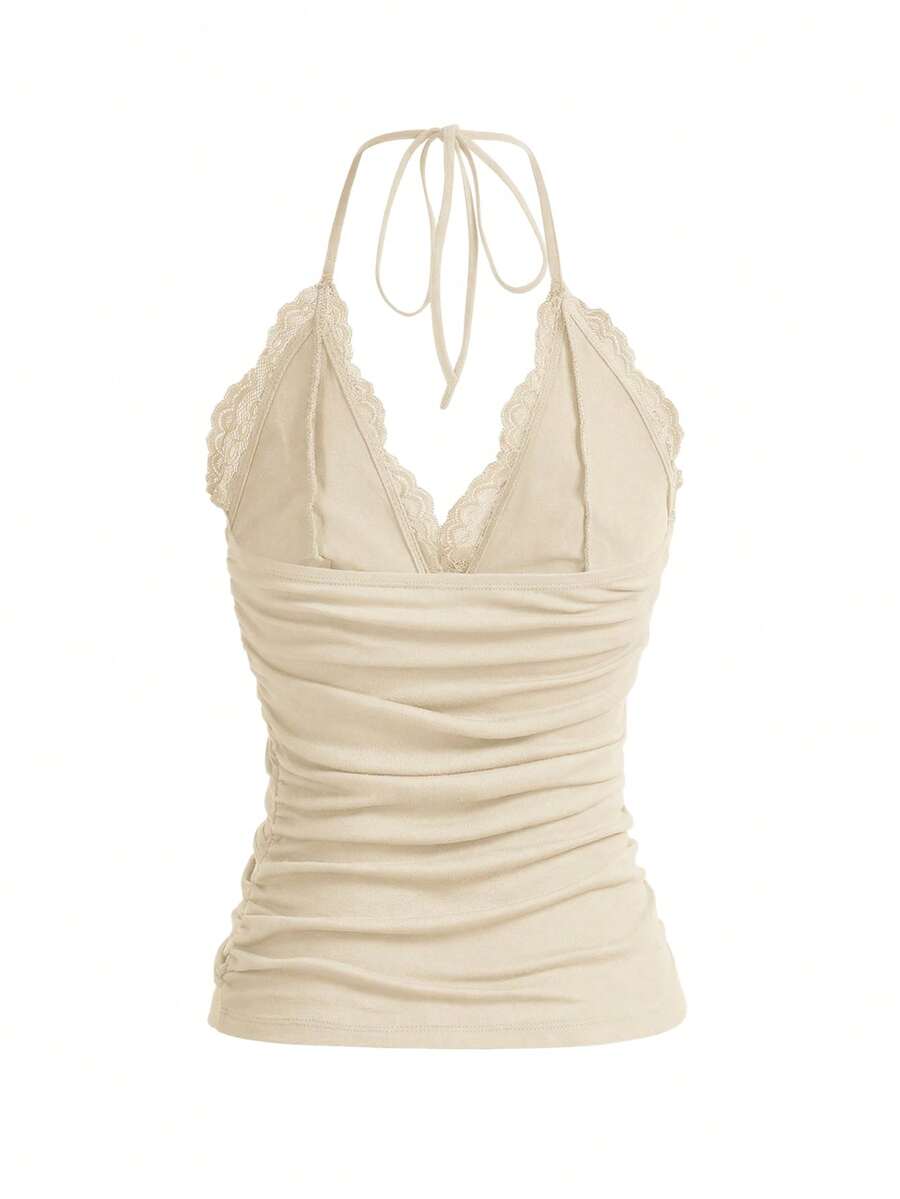 A women's black backless halter top featuring contrast lace trim, ruched front detail, and slim fit soft knitted fabric.