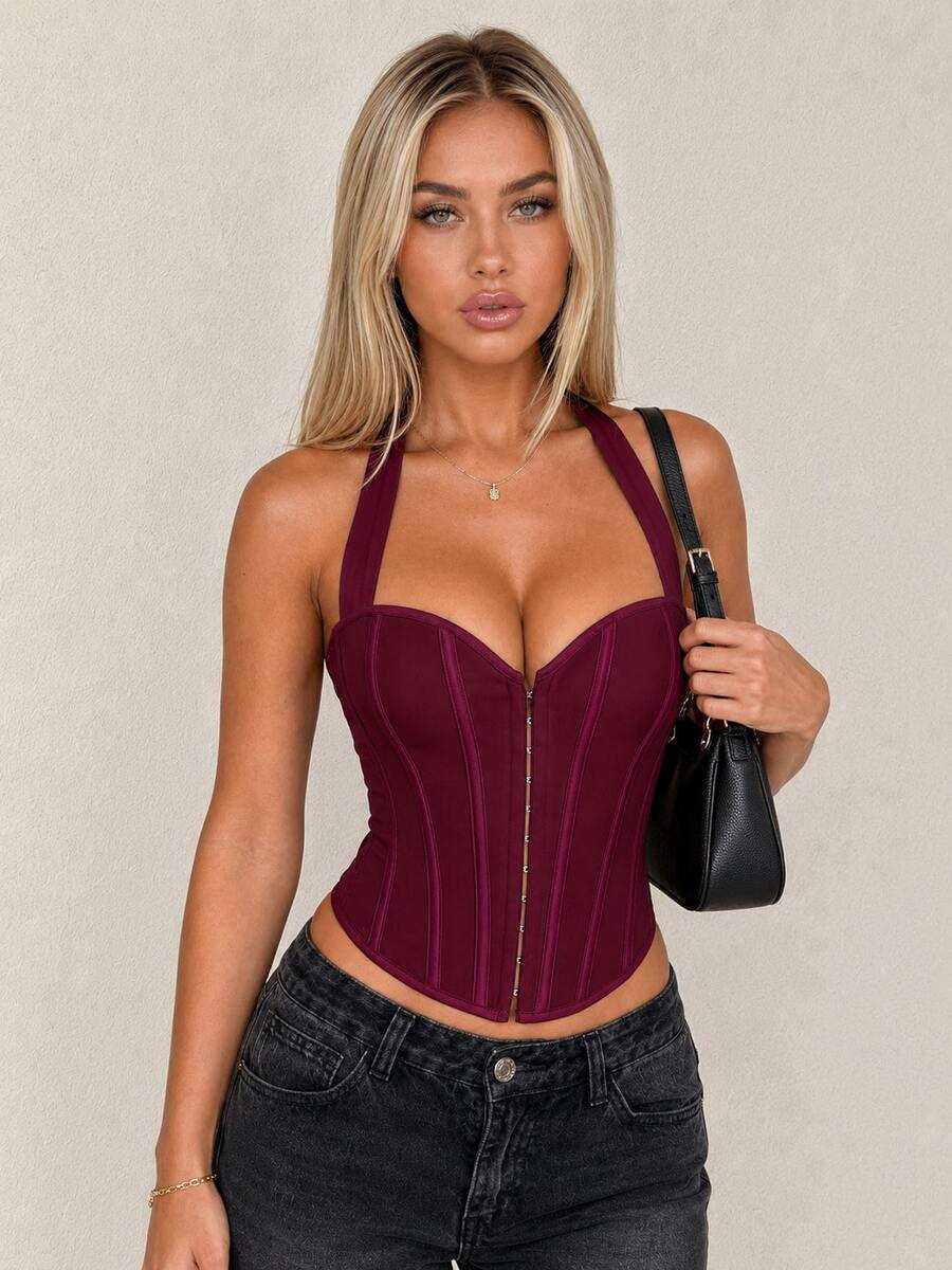 White Y2K halter backless corset top featuring lace-up back detail and metal grommet eyelets for women
