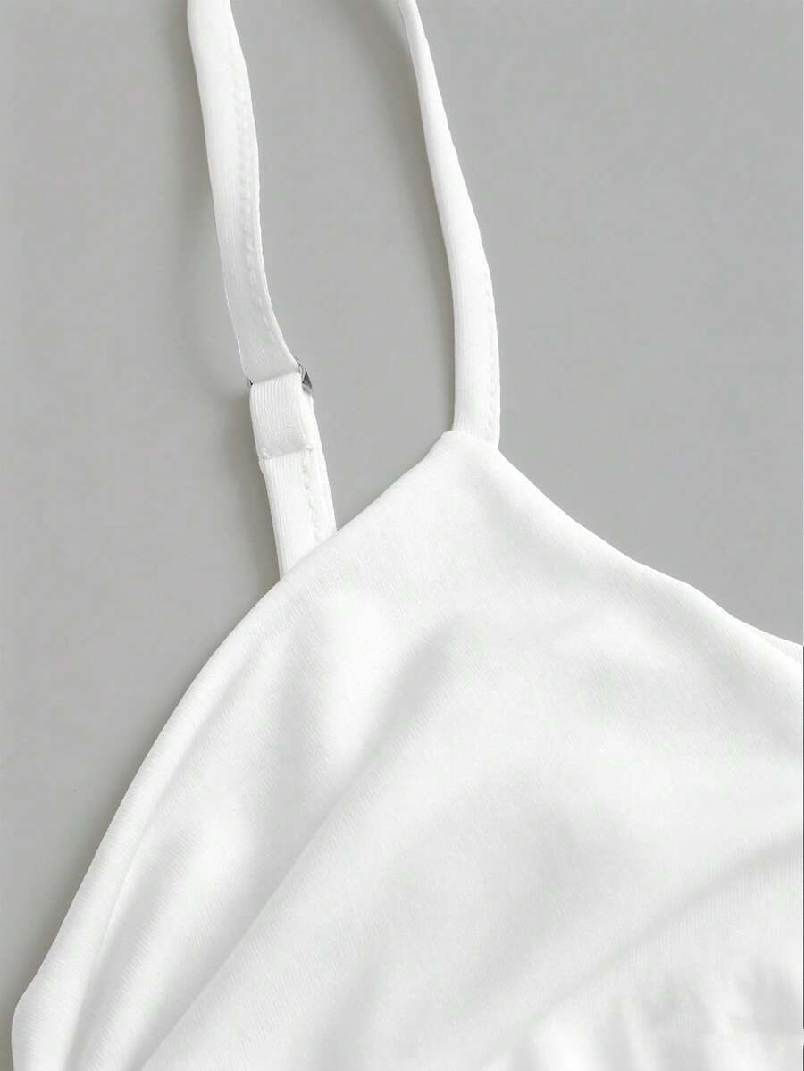 Women's coffee cowl neck cami dress with contrast lace patchwork, spaghetti straps, and an asymmetrical hem.