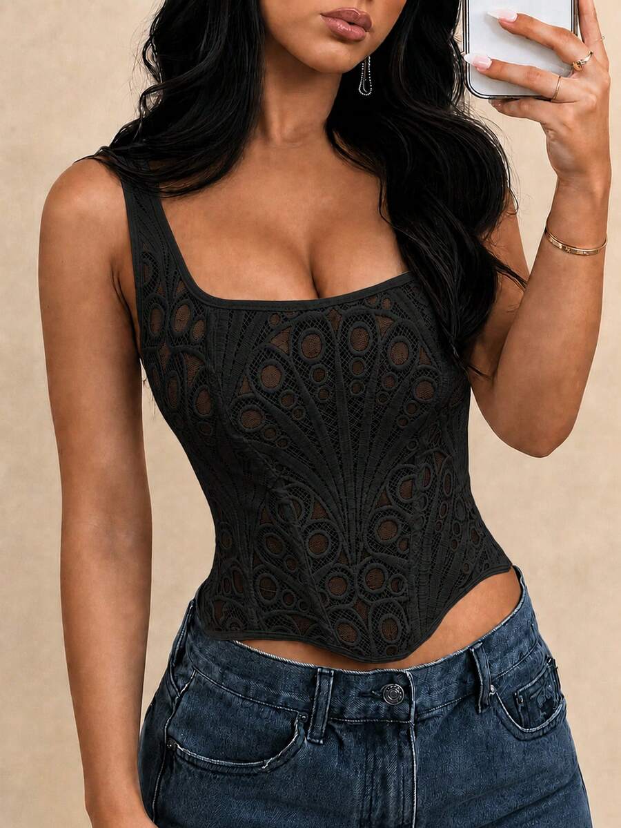 White slim fit boned corset top featuring a square neckline, wide straps, lace-up back, and asymmetrical hem.