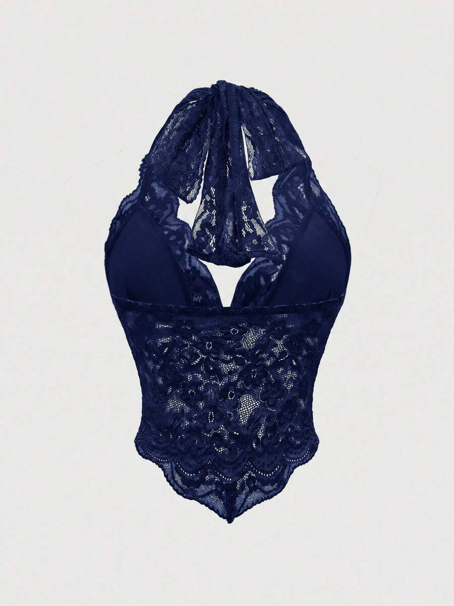 Women's black lace halter neck camisole featuring a backless crop silhouette, contrast lace trim, and scallop hem.