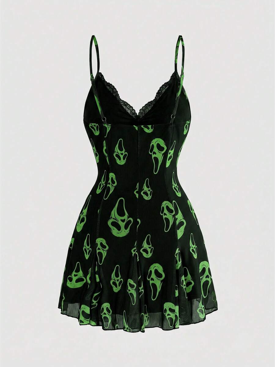 Women's black and white gothic cami mini dress featuring contrast lace trim, pleated details, high waist, and flared hem on high-stretch fabric.