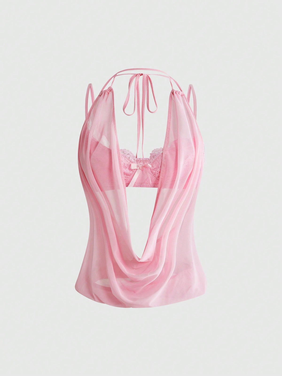 Women wearing a black draped backless halter crop top layered over a boned lace camisole.