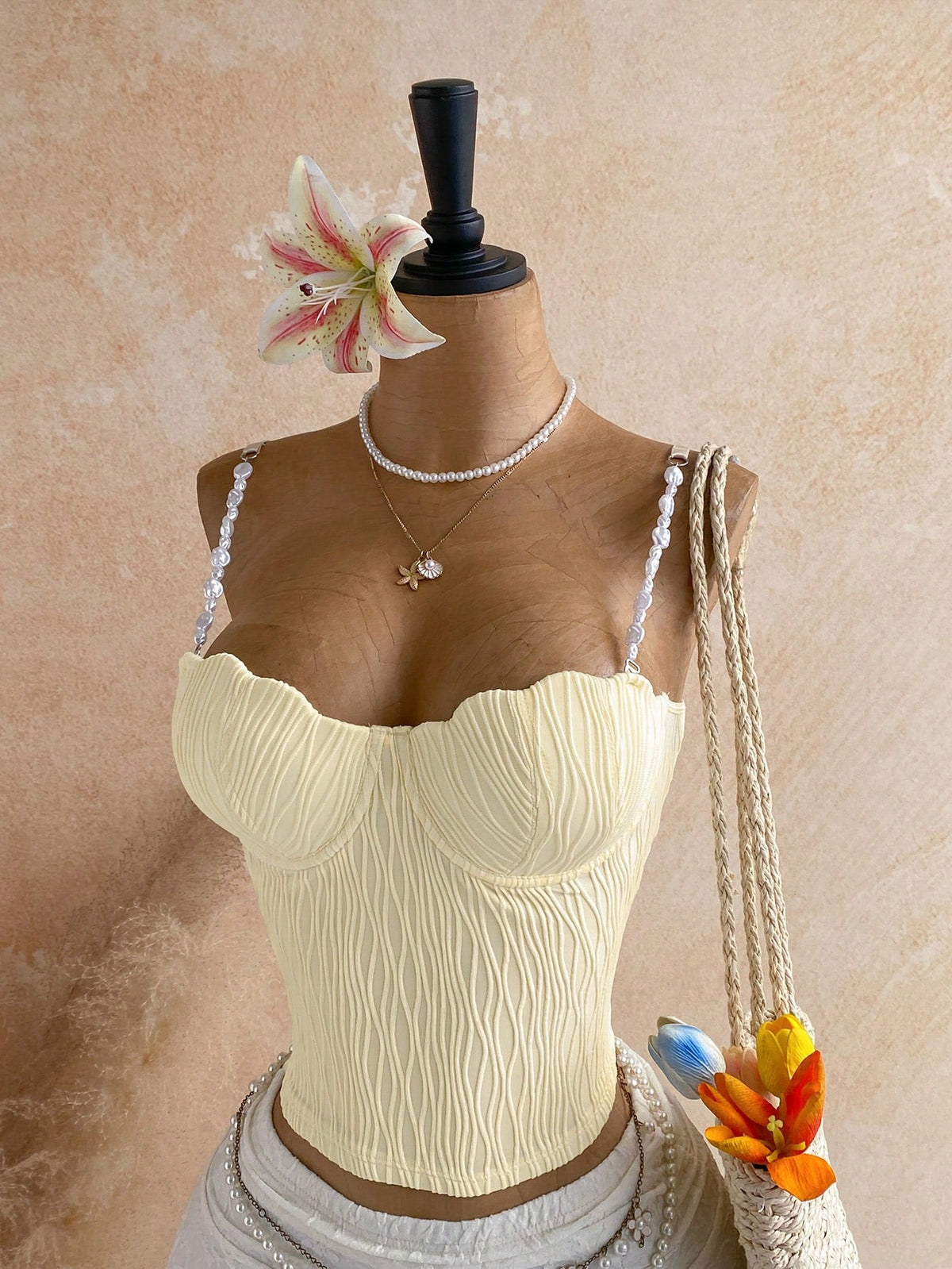 Women's black molded cup camisole top with scallop detailing and spaghetti straps.