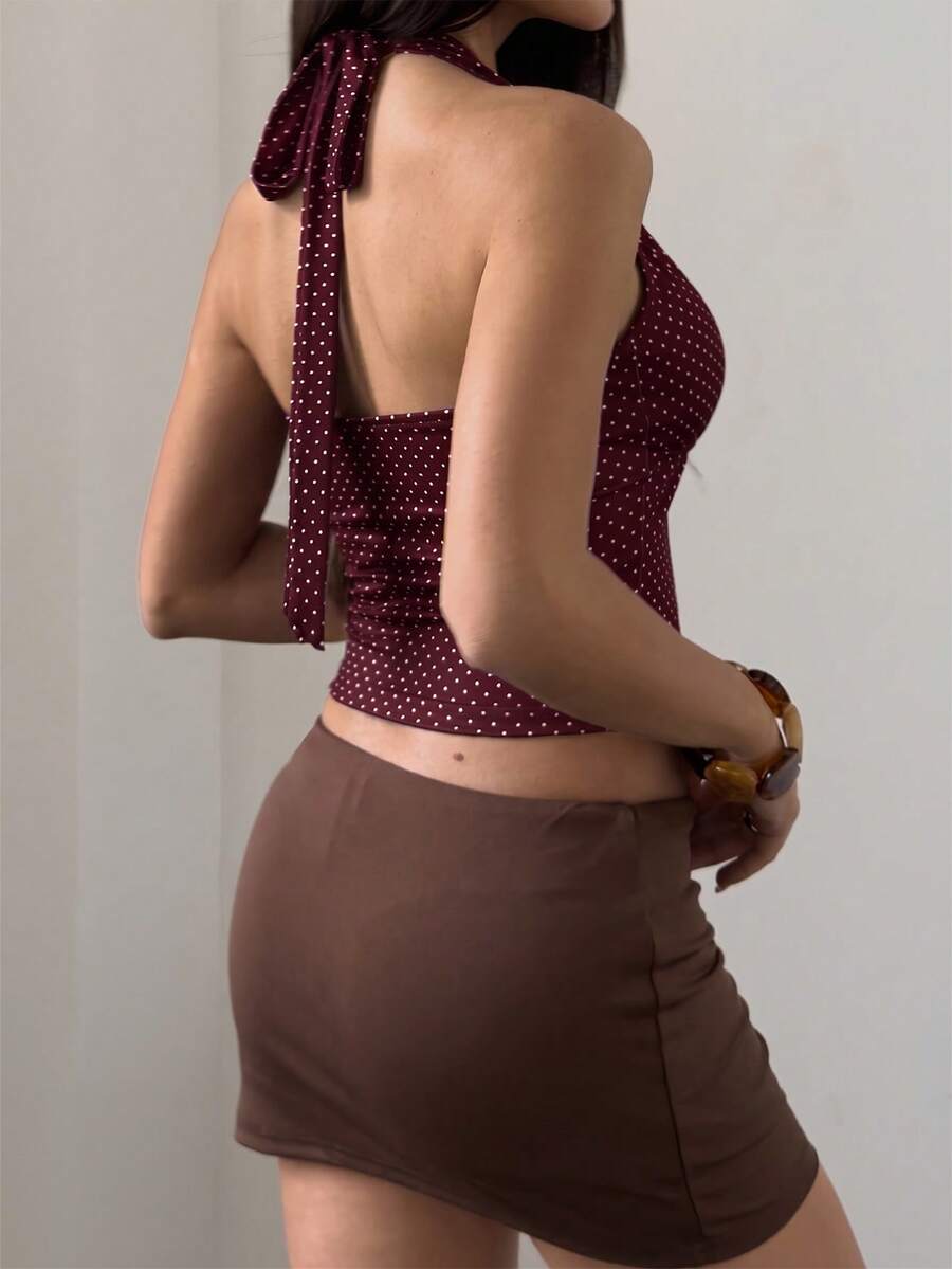 Women's sleeveless halter crop top featuring contrast lace trim and a slim fit design.