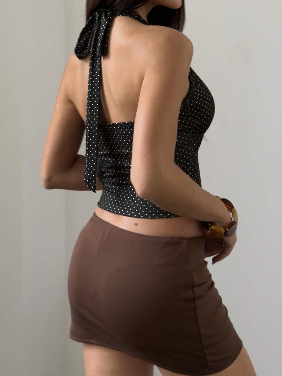 Women's sleeveless halter crop top featuring contrast lace trim and a slim fit design.