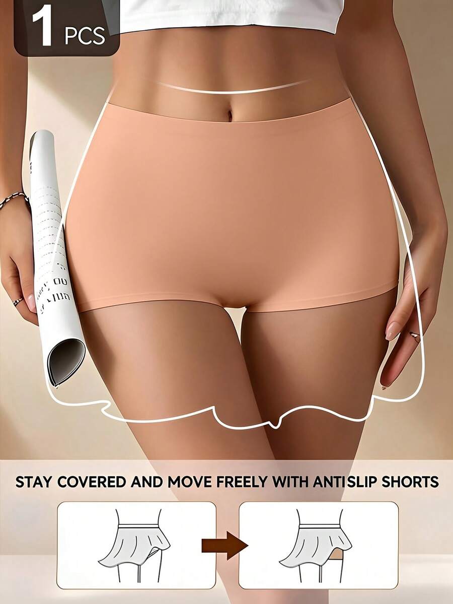 Women's black high stretch shapewear shorts with a mid waist fit and semi-sheer fabric.
