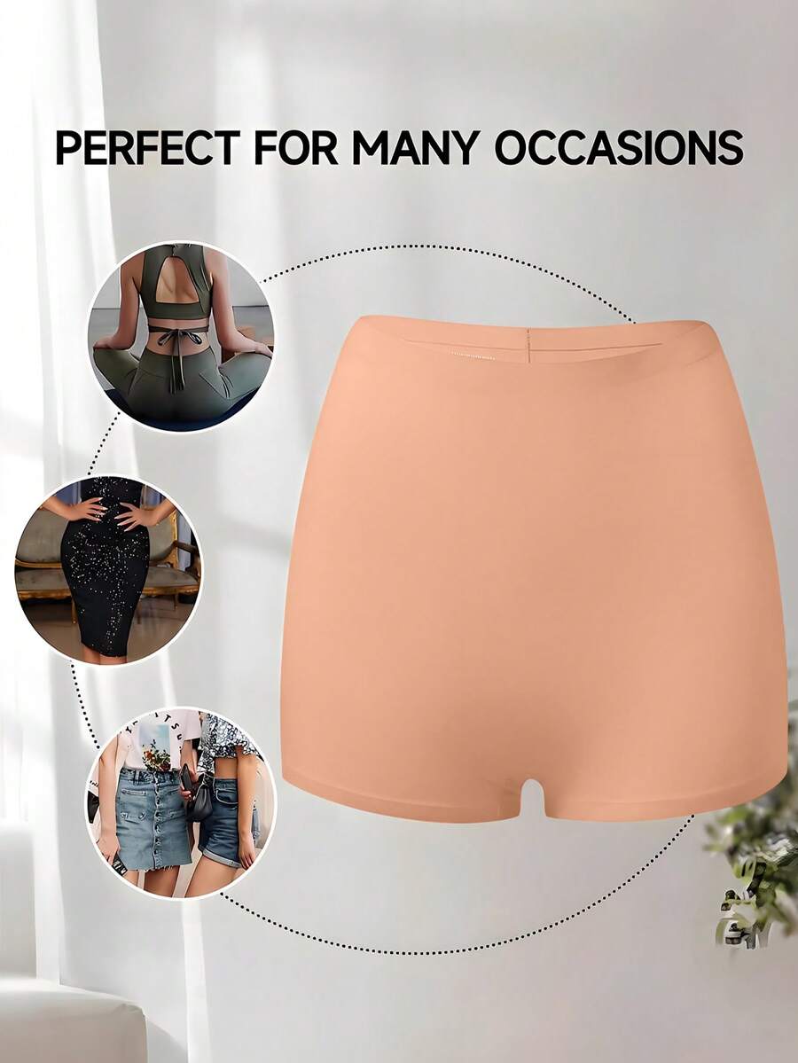 Women's black high stretch shapewear shorts with a mid waist fit and semi-sheer fabric.