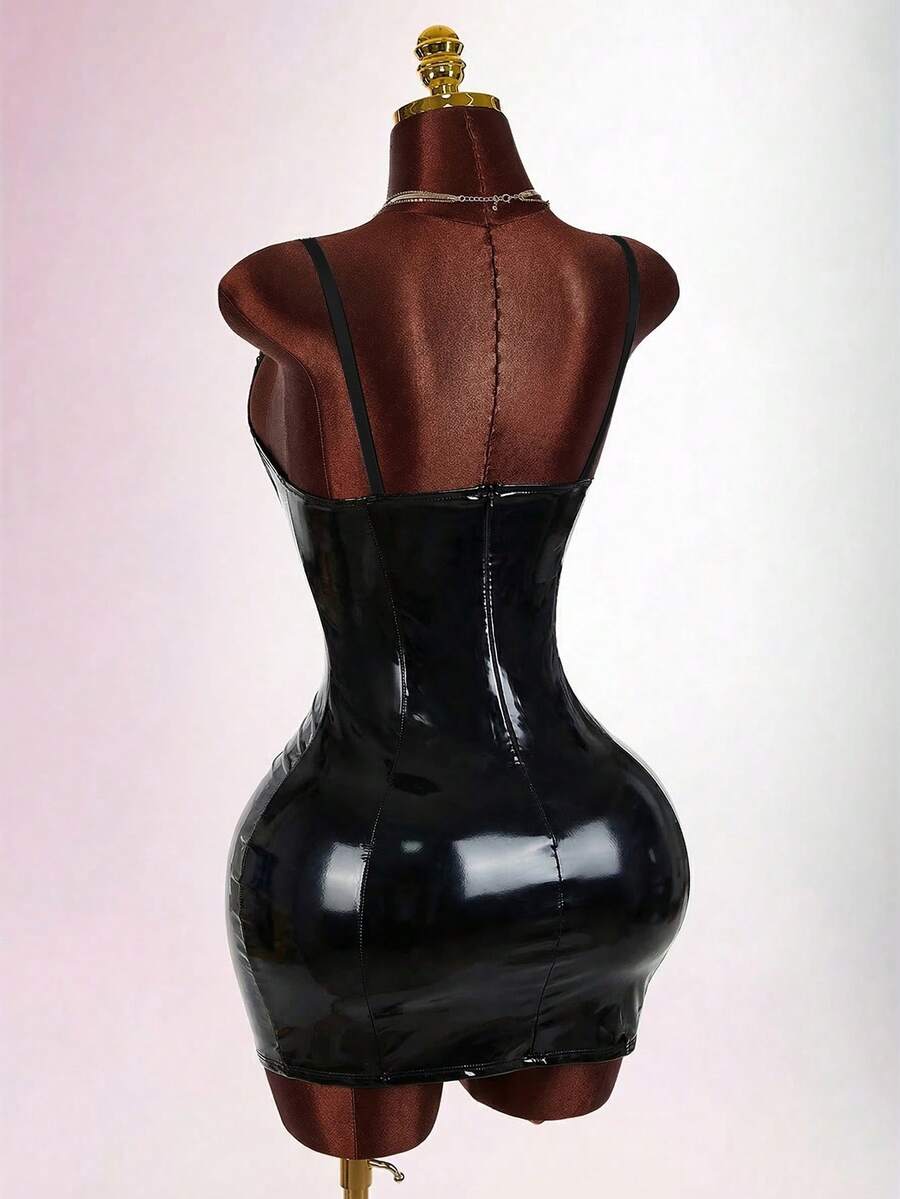 Women's sleeveless spaghetti strap mini bodycon dress featuring cup details, backless design, and zipper closure.