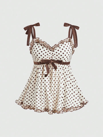 Women's apricot mesh tank top with polka dot print, featuring knot tie straps and a flared ruffle hem.