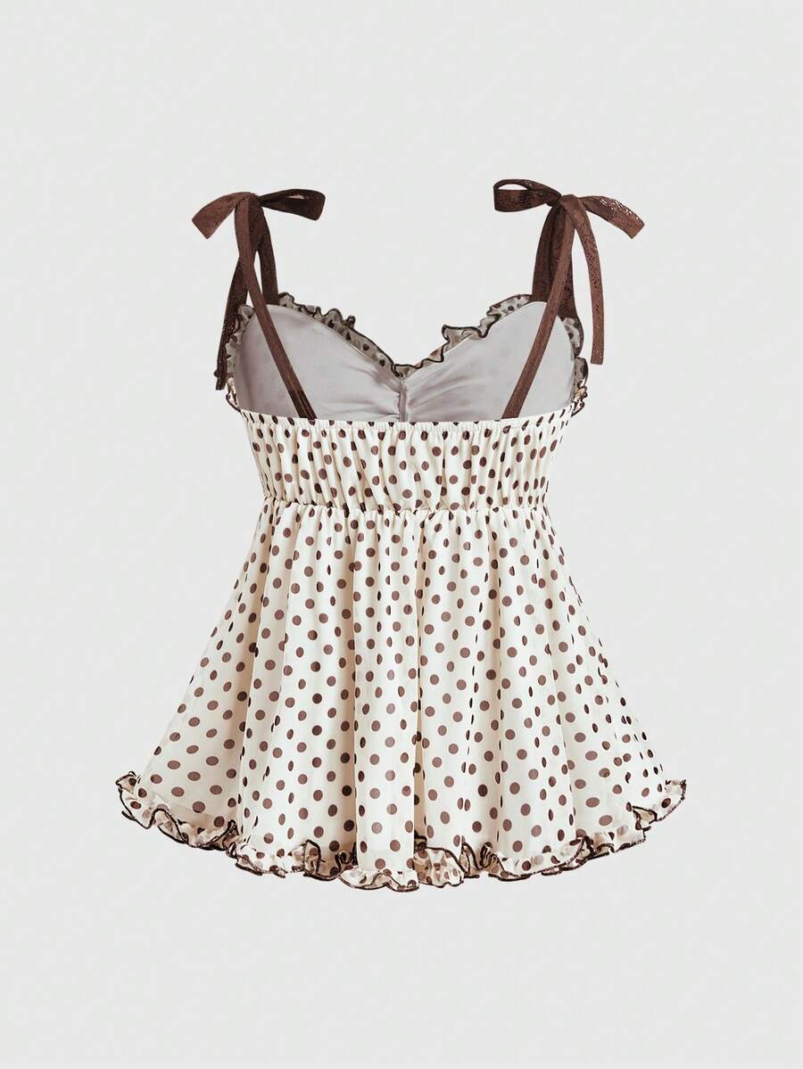 Women's apricot mesh tank top with polka dot print, featuring knot tie straps and a flared ruffle hem.