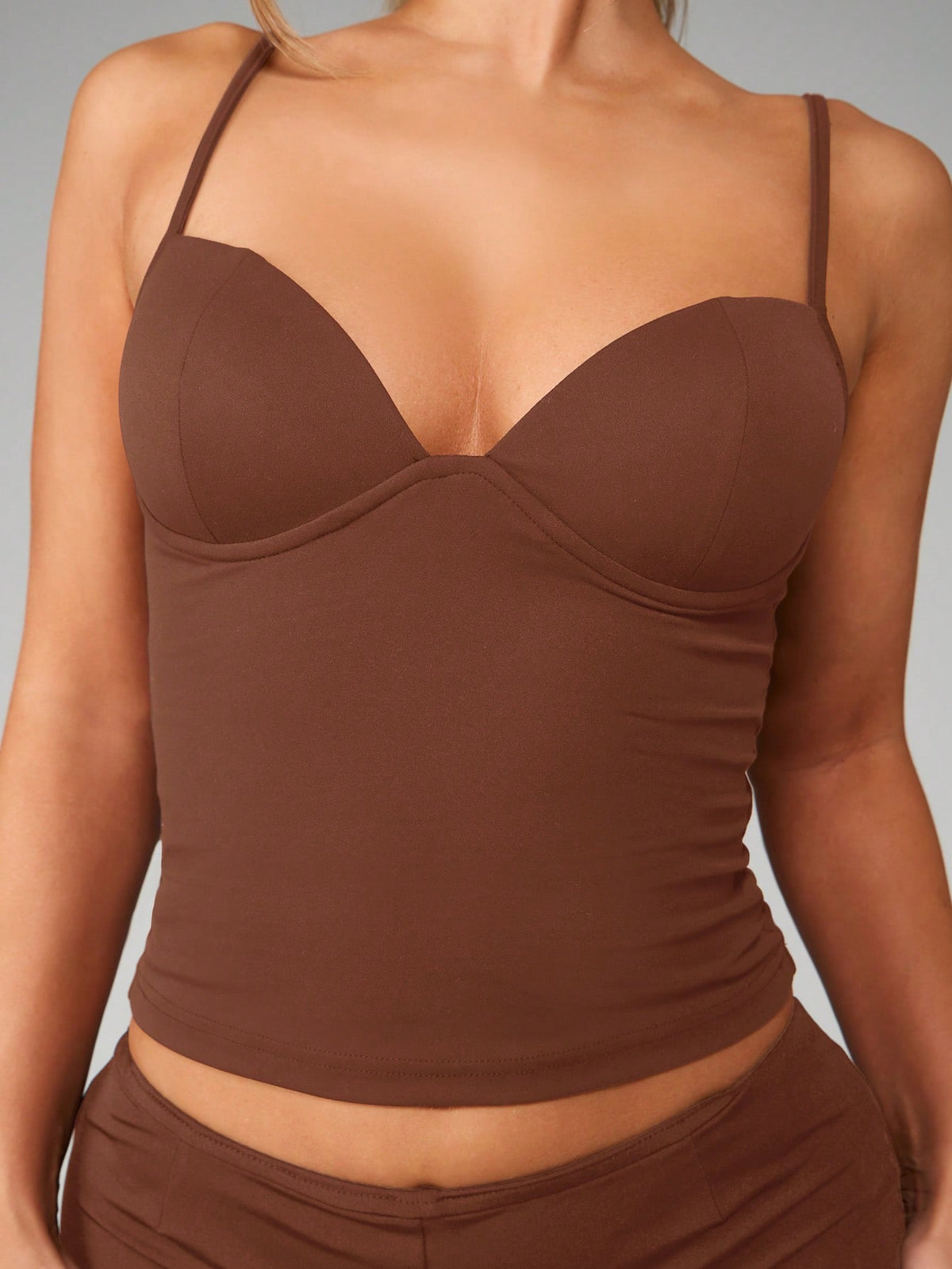 Women’s plain backless cami top with spaghetti straps and a slim fit, designed in high-stretch knitted fabric for casual beach and vacation wear.