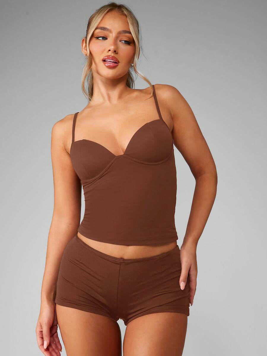Women’s plain backless cami top with spaghetti straps and a slim fit, designed in high-stretch knitted fabric for casual beach and vacation wear.