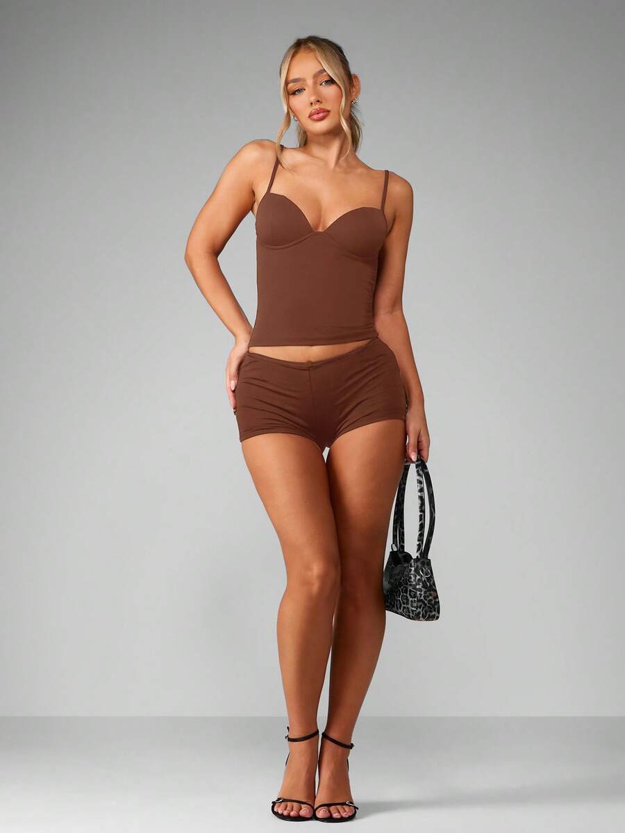 Women’s plain backless cami top with spaghetti straps and a slim fit, designed in high-stretch knitted fabric for casual beach and vacation wear.
