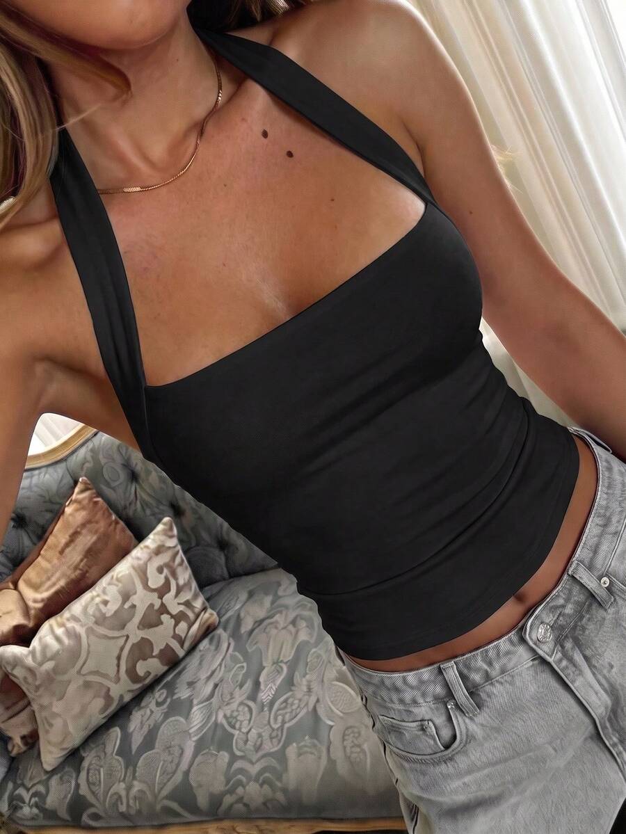 Women's striped halter camisole top featuring a backless design in knitted fabric