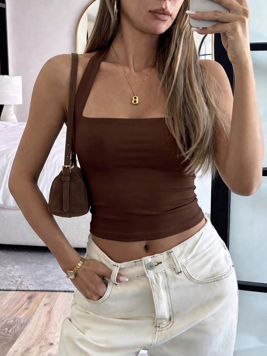 Women's striped halter camisole top featuring a backless design in knitted fabric