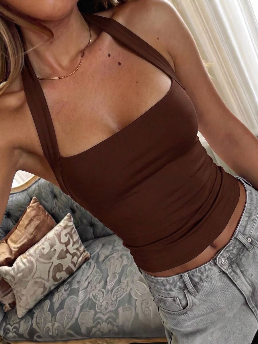 Women's striped halter camisole top featuring a backless design in knitted fabric