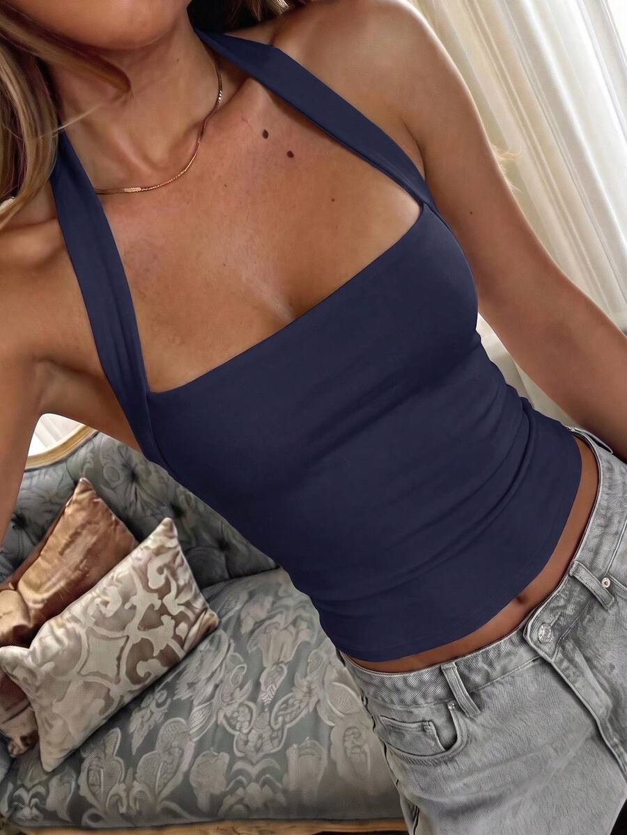 Women's striped halter camisole top featuring a backless design in knitted fabric
