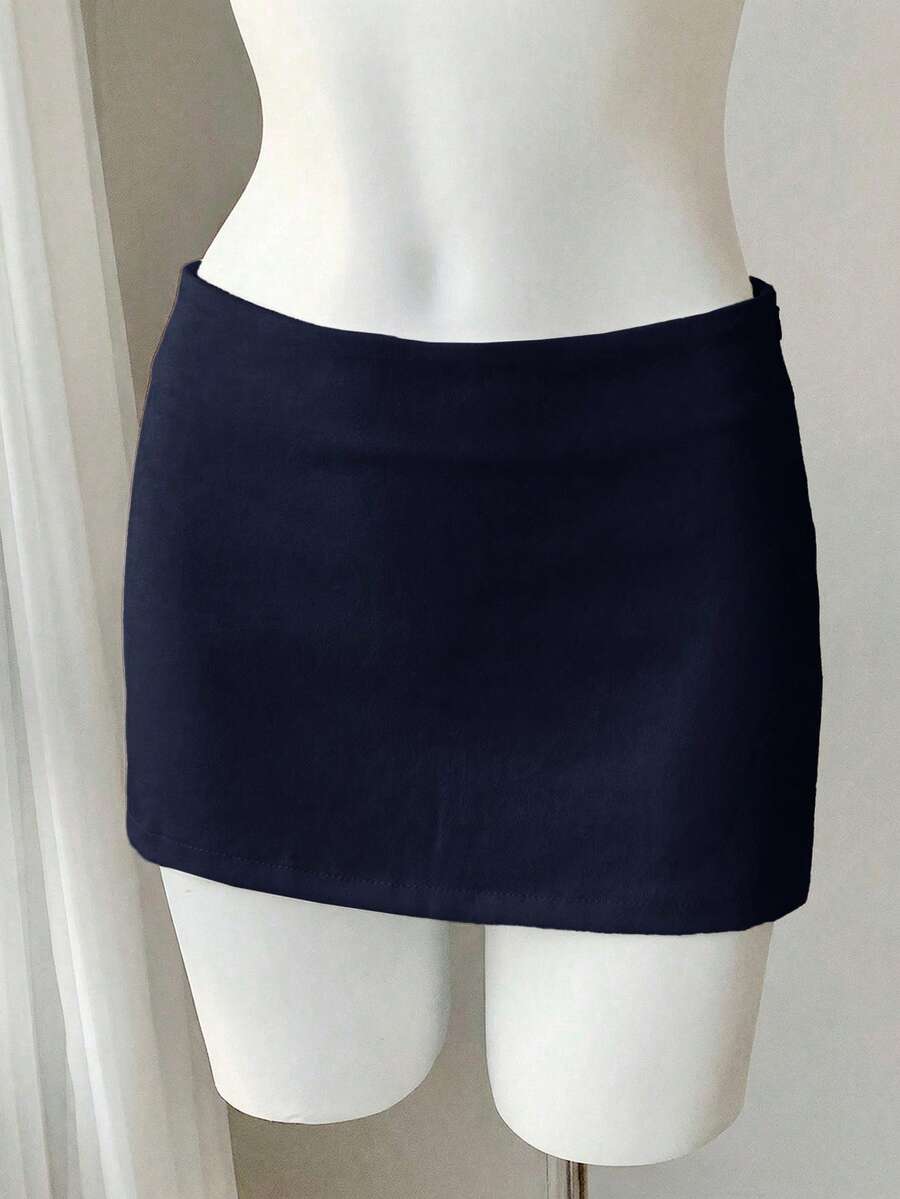 Women's white 100% cotton low waist mini skirt featuring a tropical print and zipper detail.