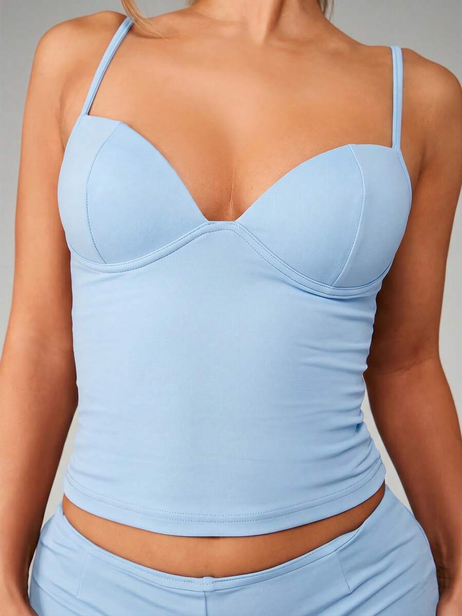 Women’s plain backless cami top with spaghetti straps and a slim fit, designed in high-stretch knitted fabric for casual beach and vacation wear.