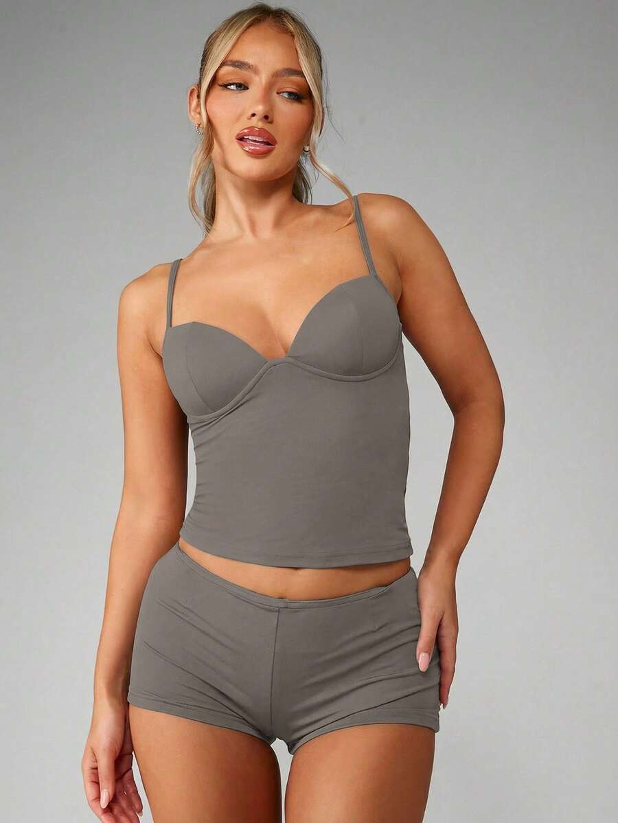 Women’s plain backless cami top with spaghetti straps and a slim fit, designed in high-stretch knitted fabric for casual beach and vacation wear.