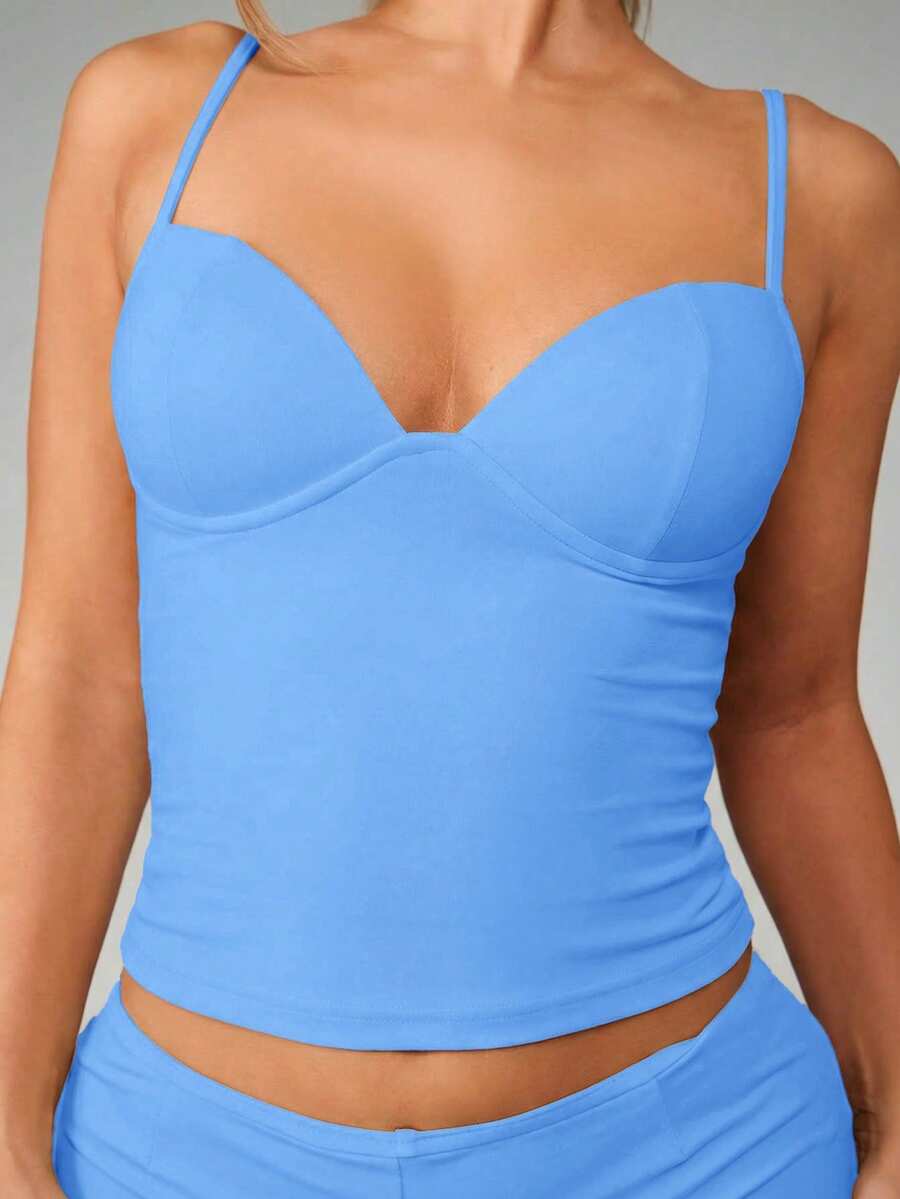Women’s plain backless cami top with spaghetti straps and a slim fit, designed in high-stretch knitted fabric for casual beach and vacation wear.