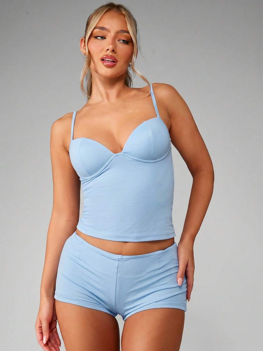 Women’s plain backless cami top with spaghetti straps and a slim fit, designed in high-stretch knitted fabric for casual beach and vacation wear.