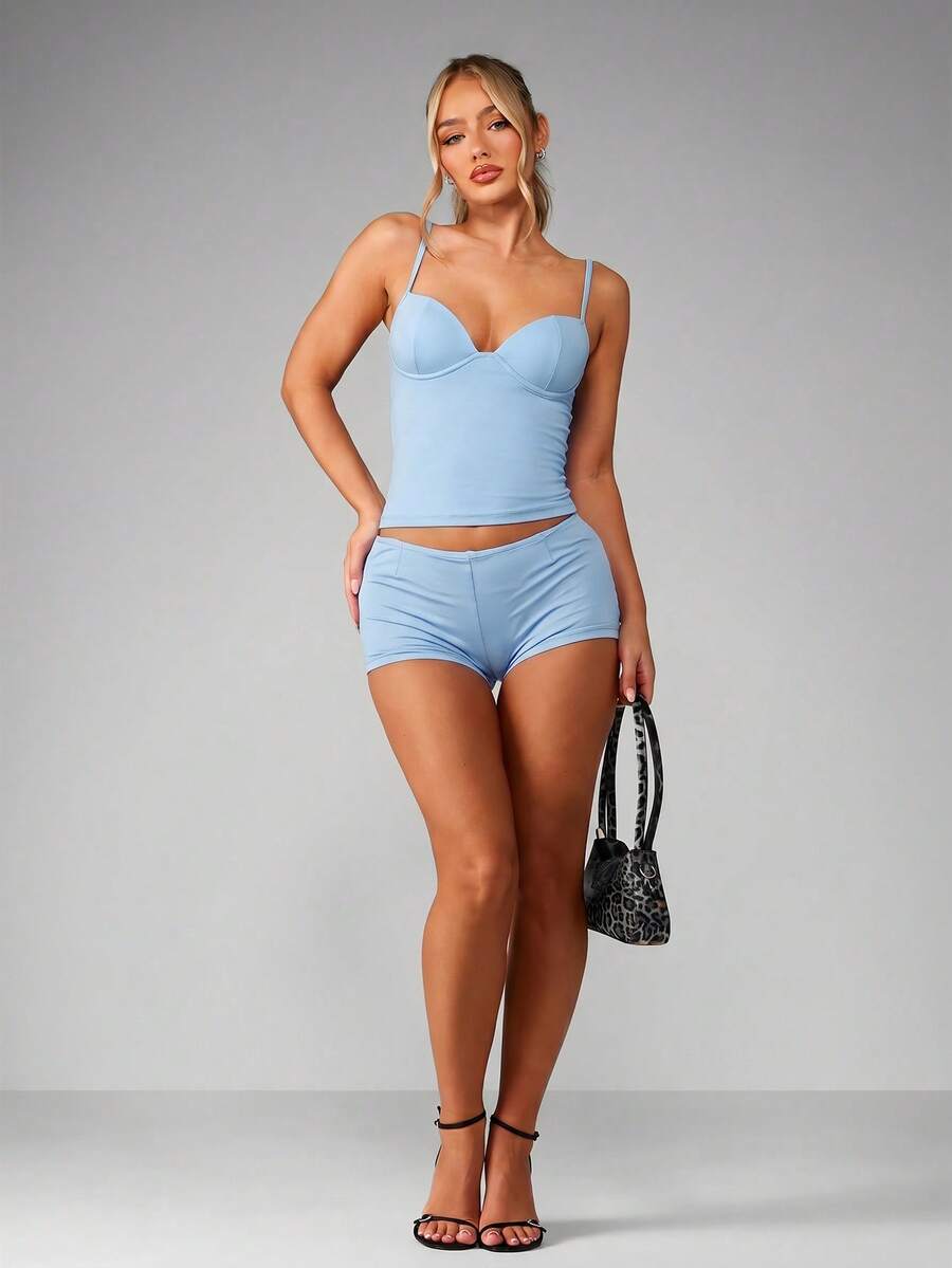 Women’s plain backless cami top with spaghetti straps and a slim fit, designed in high-stretch knitted fabric for casual beach and vacation wear.