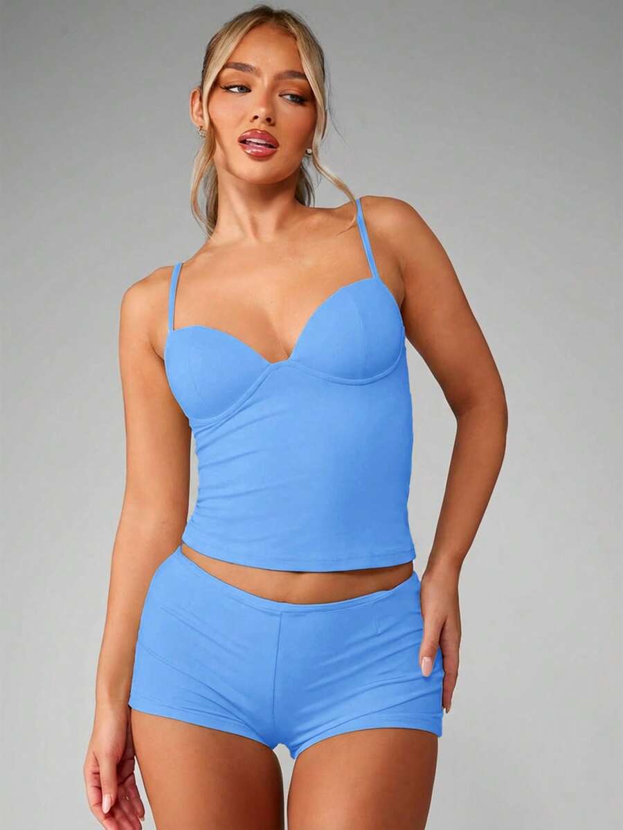 Women’s plain backless cami top with spaghetti straps and a slim fit, designed in high-stretch knitted fabric for casual beach and vacation wear.