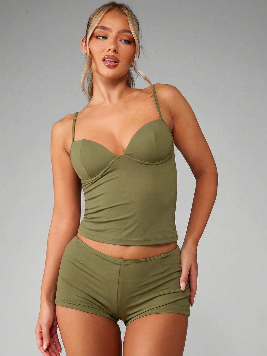 Women’s plain backless cami top with spaghetti straps and a slim fit, designed in high-stretch knitted fabric for casual beach and vacation wear.
