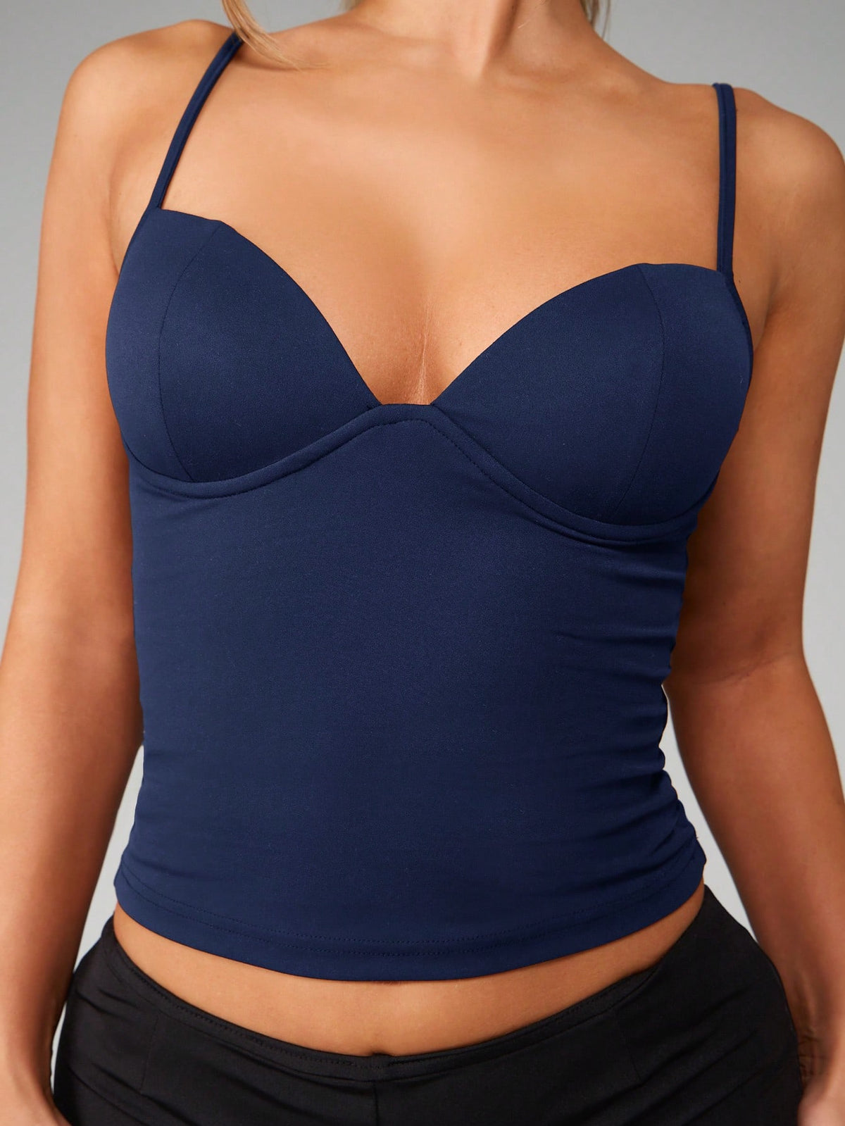Women’s plain backless cami top with spaghetti straps and a slim fit, designed in high-stretch knitted fabric for casual beach and vacation wear.