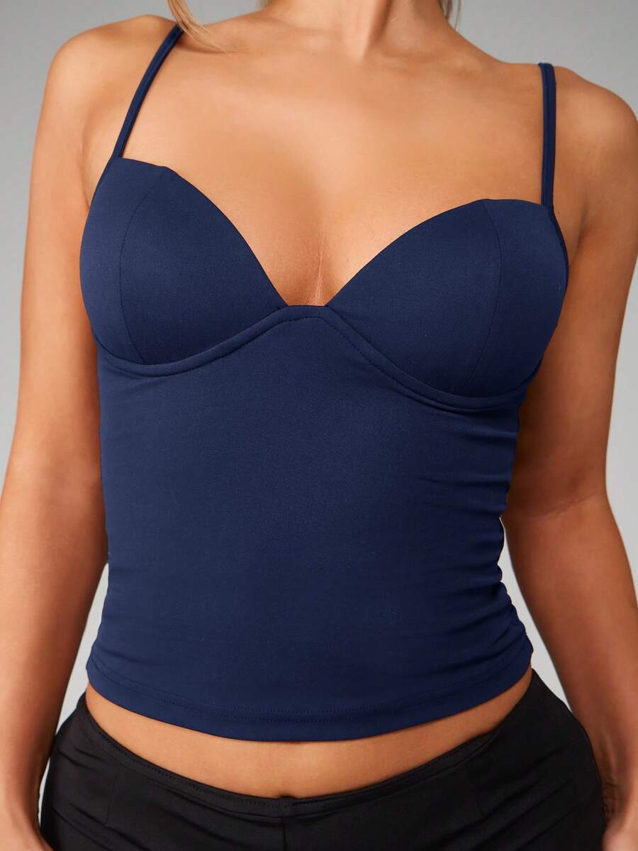 Women’s plain backless cami top with spaghetti straps and a slim fit, designed in high-stretch knitted fabric for casual beach and vacation wear.