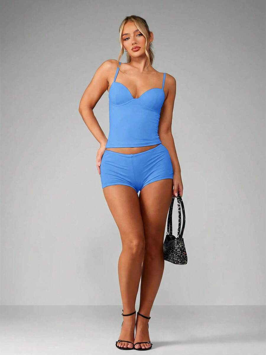 Women’s plain backless cami top with spaghetti straps and a slim fit, designed in high-stretch knitted fabric for casual beach and vacation wear.