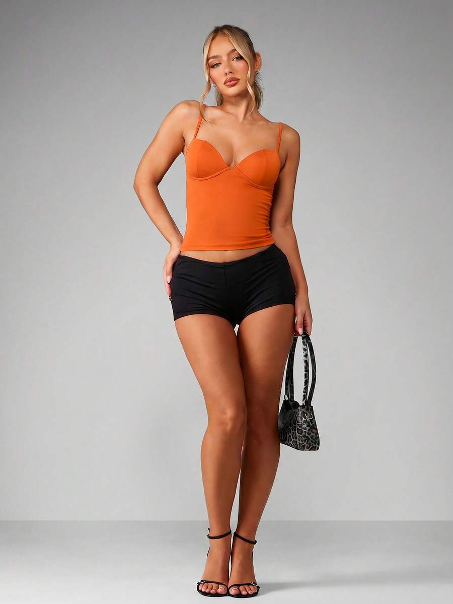 Women’s plain backless cami top with spaghetti straps and a slim fit, designed in high-stretch knitted fabric for casual beach and vacation wear.