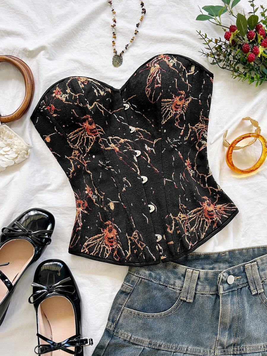 Strapless black lace-up corset top for women with grommet eyelet details, slim fit, lined body, and woven fabric construction.