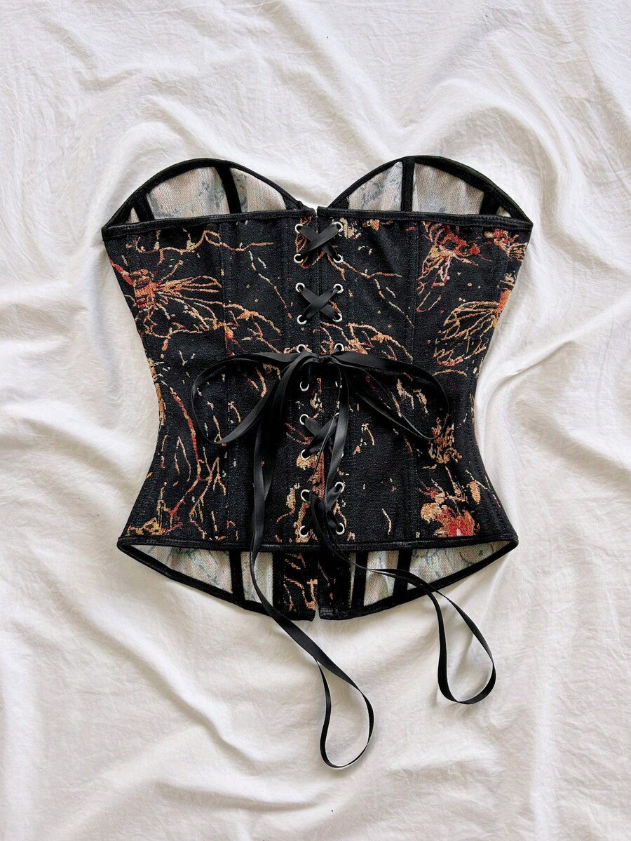 Strapless black lace-up corset top for women with grommet eyelet details, slim fit, lined body, and woven fabric construction.