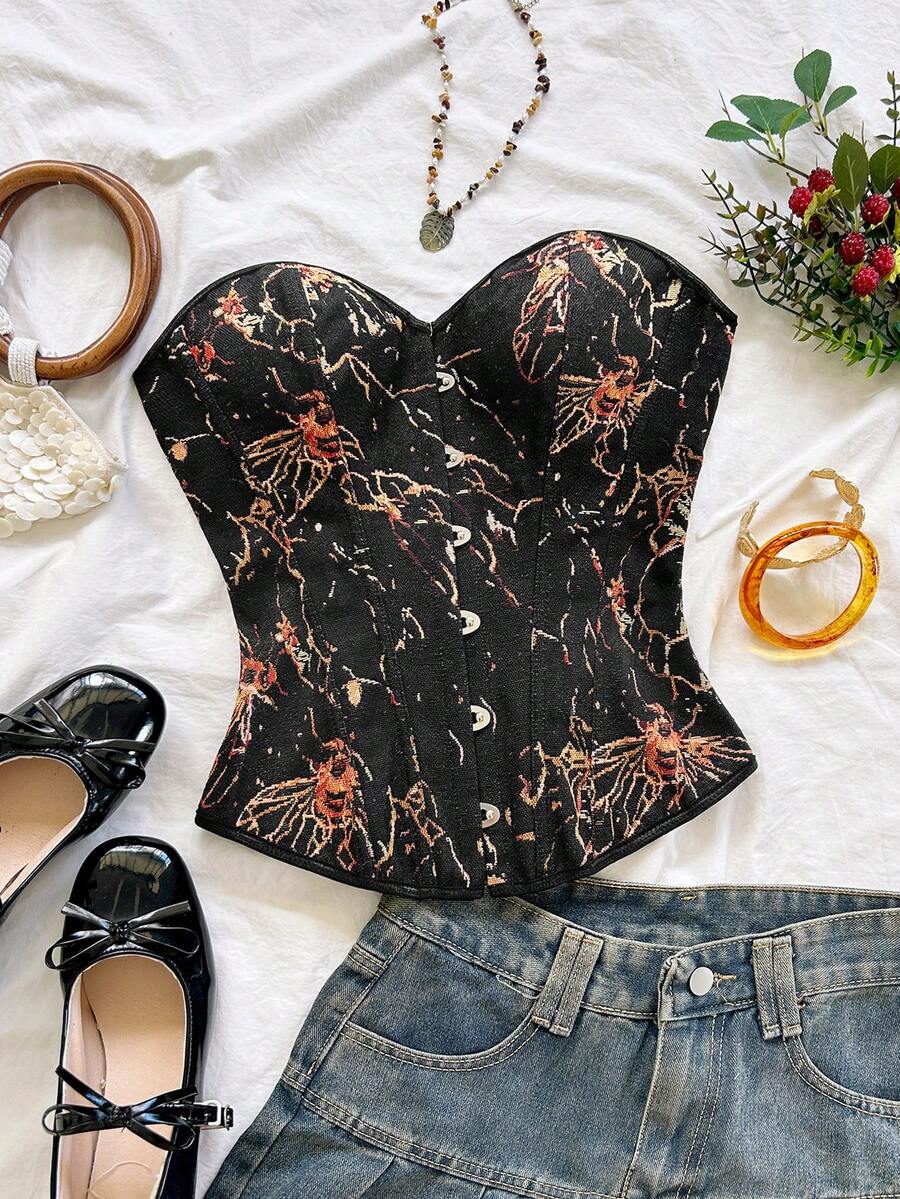 Strapless black lace-up corset top for women with grommet eyelet details, slim fit, lined body, and woven fabric construction.