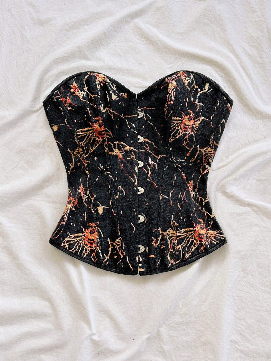 Strapless black lace-up corset top for women with grommet eyelet details, slim fit, lined body, and woven fabric construction.
