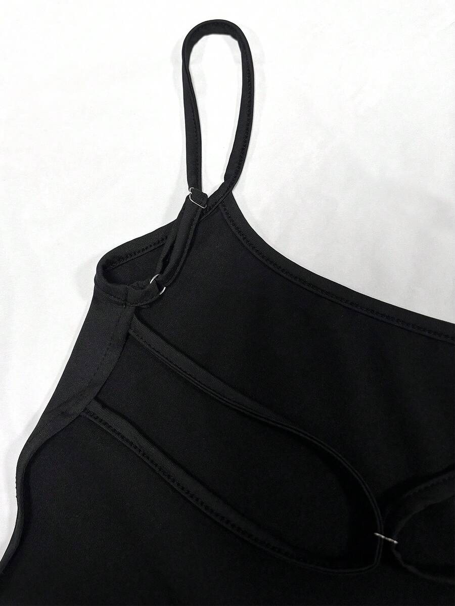 Black backless long cami dress for women featuring criss-cross straps, sleeveless design, and side slit.