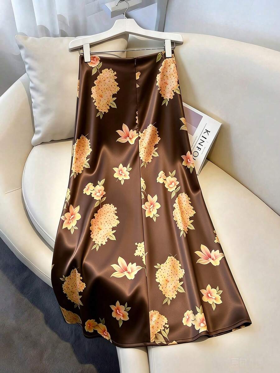 Women's elegant black A-line long skirt featuring a plain woven fabric, regular fit, natural mid-waist style, and flared hem design suitable for formal and evening wear.