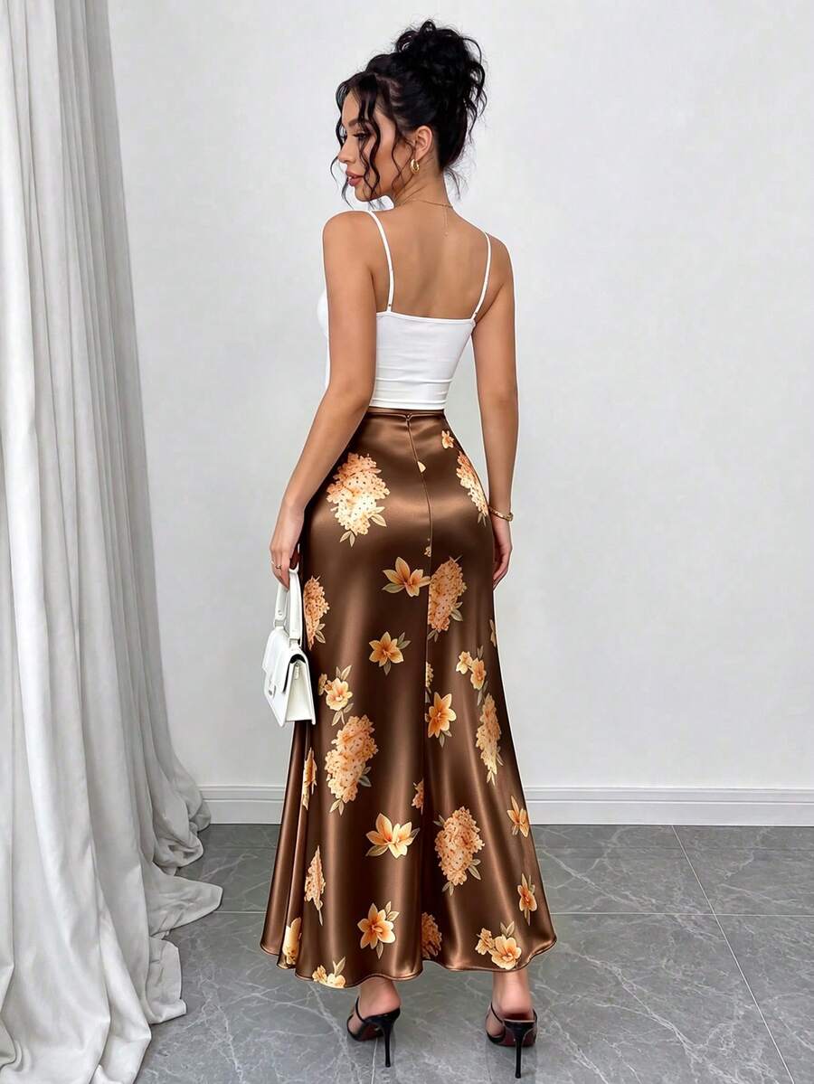 Women's elegant black A-line long skirt featuring a plain woven fabric, regular fit, natural mid-waist style, and flared hem design suitable for formal and evening wear.
